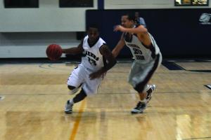 Mercyhurst College junior Jason Snow dribbles past a Virginia Union defender in the Lakers 73-61 victory.